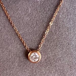 Travel Treasures Rose Gold tone pendant w cubic zirconia.
